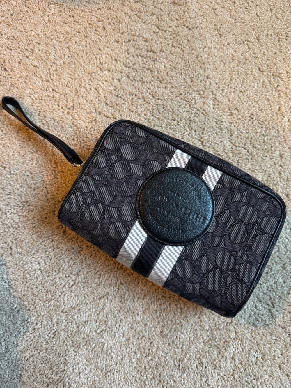 Coach women’s Black Signature Canvas Wristlet with White and Black Stripe Accent
